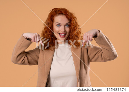 Young Businesswoman Blogger Pointing Below, Advertising Adds. Click To Subscribe 135485874