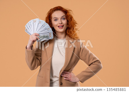 Rich Businesswoman With Usd Cash Money Dollars On Beige, Income Payment Rich Businesswoman With Usd Cash Money Dollars On Beige, Income Payment 135485881