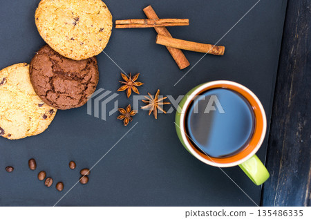 Sweet oats gingerbread with spices. A mug of coffee and gingerbread. Sweet oats gingerbread with spices. A mug of coffee and gingerbread. 135486335