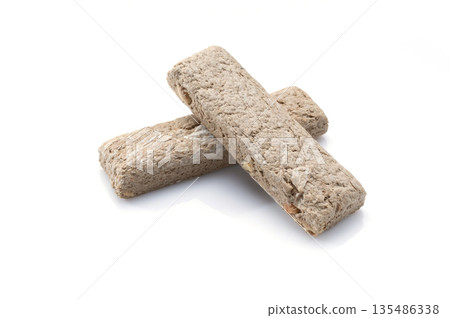 Traditional sunflower seed halva on a white background. Traditional sunflower seed halva on a white background. 135486338