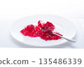 Minimalistic composition with a white plate on a white background, sweet dessert concept. 135486339
