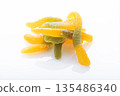 Macro photo of colorful gummy candies shaped like worms. 135486340