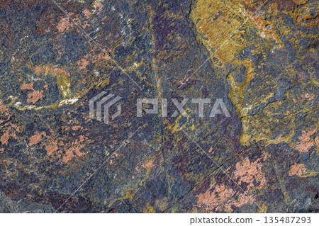 Rough textured rock formation in natural outdoor setting Rough textured rock formation in natural outdoor setting 135487293
