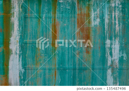 Weathered metal surface with rust and paint texture outdoors 135487496