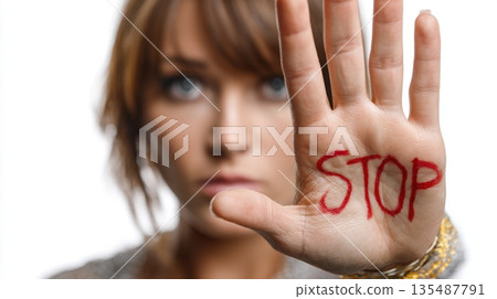 Woman showing stop sign with hand symbol against violence and abuse 135487791