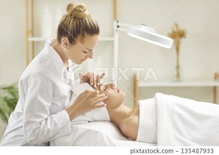 Dermatologist Performs Facial Treatment in Salon Dermatologist Performs Facial Treatment in Salon 135487933