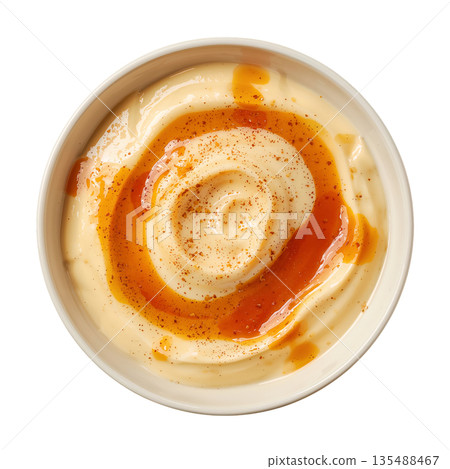 Creamy Sauce in a Round White Bowl on a Plain Surface Ready for Serving With Food 135488467