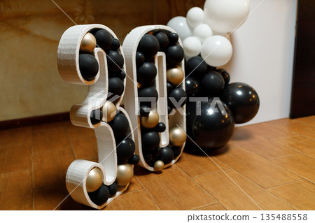 Number 30 birthday decoration with black gold and white balloons 135488558
