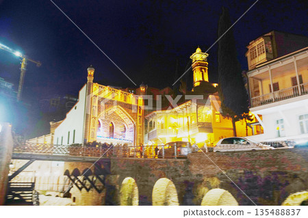 Night view Abanotubani square with small river there many many bathouses in Tbilisi Night view Abanotubani square with small river there many many bathouses in Tbilisi 135488837