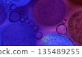 Oil bubbles floating in colored water - Macro. 135489255