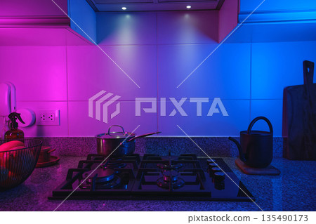 Modern kitchen interior with colorful neon lighting 135490173