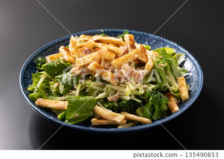 Chopped fried tofu, tuna and lettuce salad 135490653