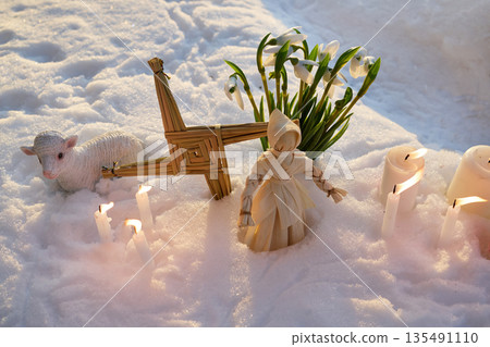 Imbolc pagan altar with brigid's cross in snow Imbolc pagan altar with brigid's cross in snow 135491110