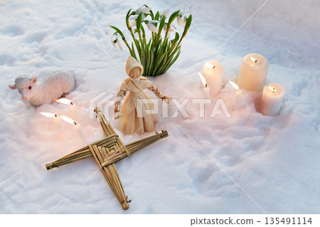 Imbolc brigid's cross and corn dolly ritual in snow 135491114