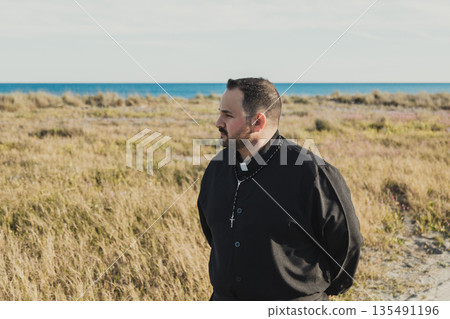 Priest Spreading The Faith At The Sea Priest Spreading The Faith At The Sea 135491196