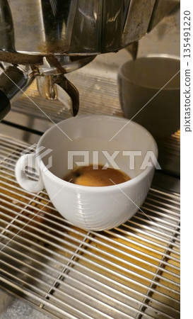 Freshly Brewed Espresso in a White Coffee Cup Freshly Brewed Espresso in a White Coffee Cup 135491220