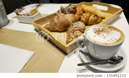 Delicious Croissants and Creamy Coffee for Breakfast Delicious Croissants and Creamy Coffee for Breakfast 135491222