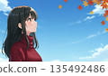 A woman standing under the autumn sky 135492486