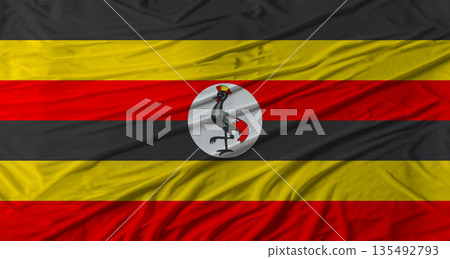 Ugandan flag waving. Flag of Uganda with cloth texture Ugandan flag waving. Flag of Uganda with cloth texture 135492793