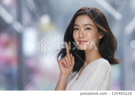 Young Japanese woman pointing (pointing point) Generative AI 135493228