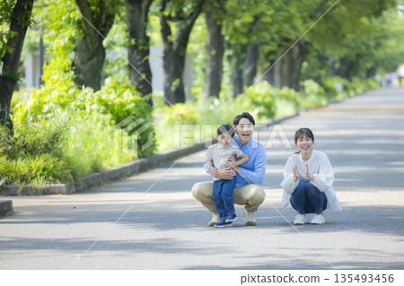 Family walking in the fresh green park Family walking in the fresh green park 135493456