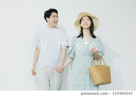 A young woman wearing a light blue dress A young woman wearing a light blue dress 135493547