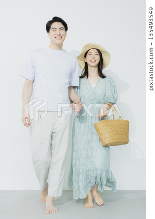 A young woman wearing a light blue dress 135493549
