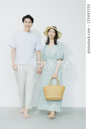 A young woman wearing a light blue dress A young woman wearing a light blue dress 135493550