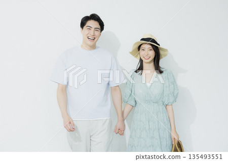 A young woman wearing a light blue dress 135493551