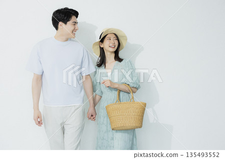 A young woman wearing a light blue dress 135493552