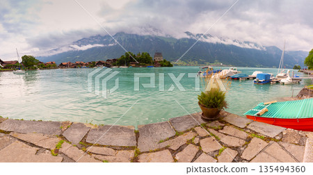 Lake Brienz and historic building in Iseltwald Switzerland Lake Brienz and historic building in Iseltwald Switzerland 135494360