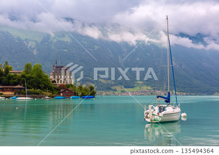 Lake Brienz and historic building in Iseltwald Switzerland Lake Brienz and historic building in Iseltwald Switzerland 135494364
