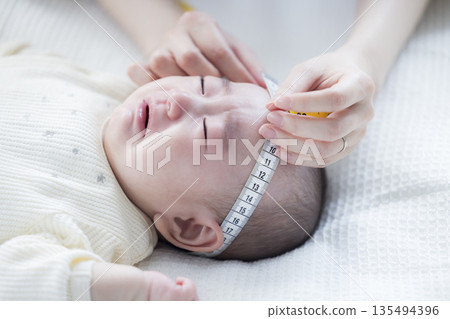Infant checkup image 135494396