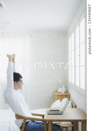 Man using a computer Man using a computer 135494667