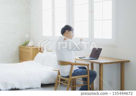 Man using a computer Man using a computer 135494672