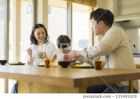 A happy family at the dinner table A happy family at the dinner table 135495029