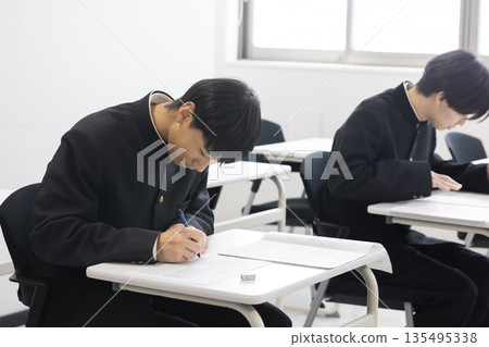 Male high school student studying Male high school student studying 135495338