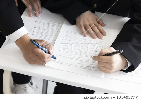 Boys studying to study 135495777