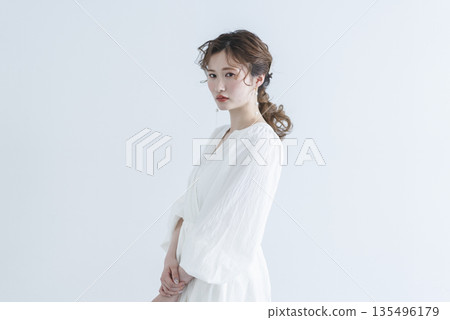 Young woman wearing a refreshing dress Young woman wearing a refreshing dress 135496179
