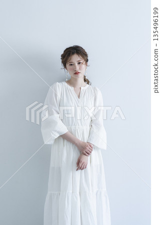Young woman wearing a refreshing dress Young woman wearing a refreshing dress 135496199