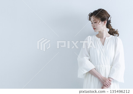 Young woman wearing a refreshing dress Young woman wearing a refreshing dress 135496212