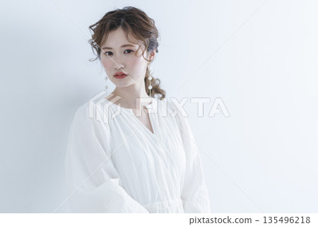 Young woman wearing a refreshing dress Young woman wearing a refreshing dress 135496218