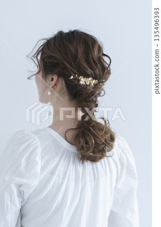 A young woman's back view A young woman's back view 135496393