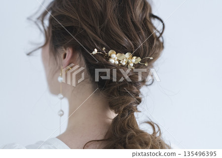 A young woman's back view A young woman's back view 135496395