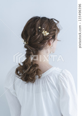 A young woman's back view A young woman's back view 135496396