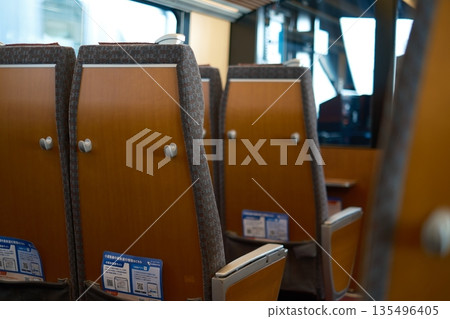 Empty train seats and driver's seat 135496405