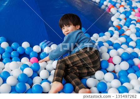 Children playing in the ball pool 135497262