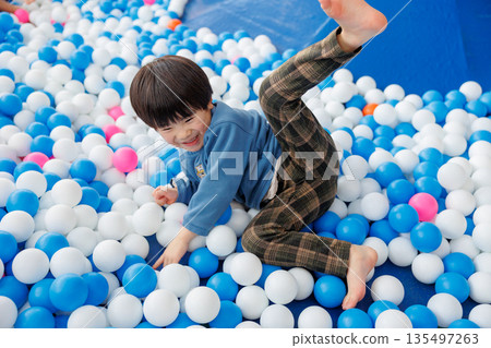 Children playing in the ball pool 135497263