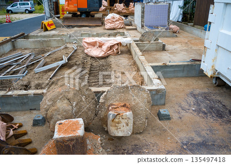 Demolition site of an old wooden house 135497418
