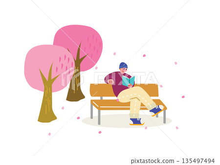 A man reading a book under a cherry tree A man reading a book under a cherry tree 135497494